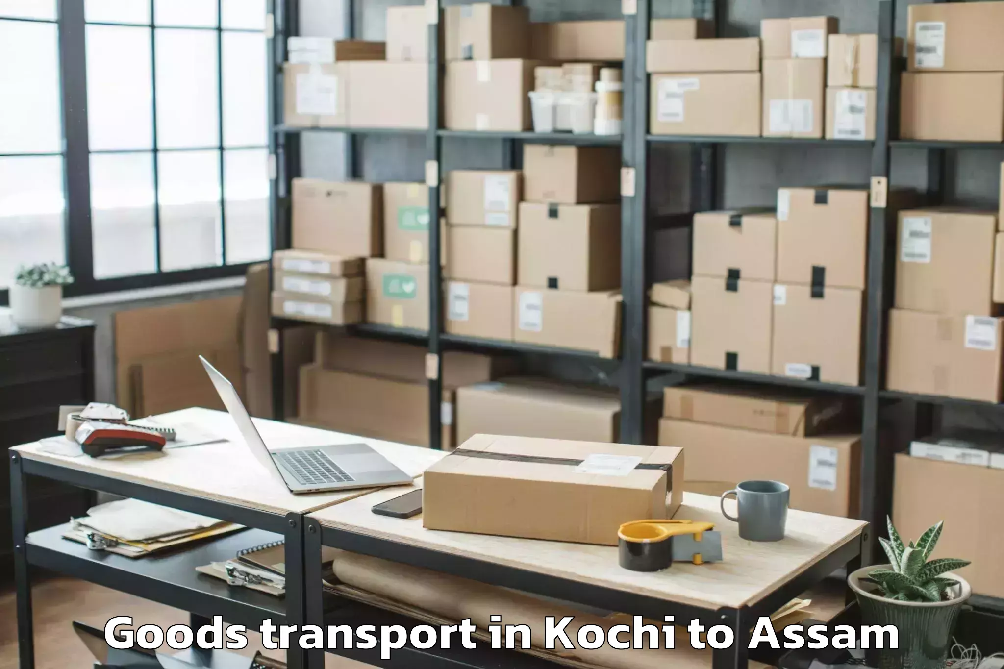 Top Kochi to Baganpara Goods Transport Available